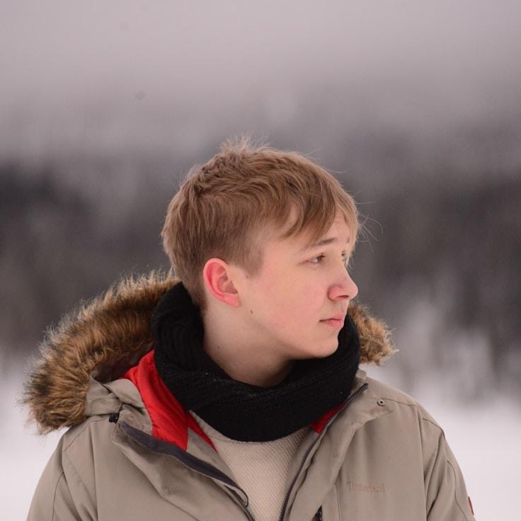 Alex Rivera, Lead Design Curator at LawnToneCurrent, reviewing corporate floral arrangements